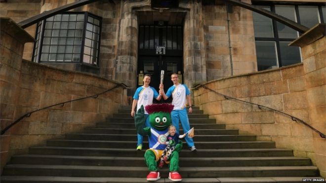 William Mitchell and Michael Aldridge, with Clyde the Glasgow 2014 mascot, at Glasgow School of Art
