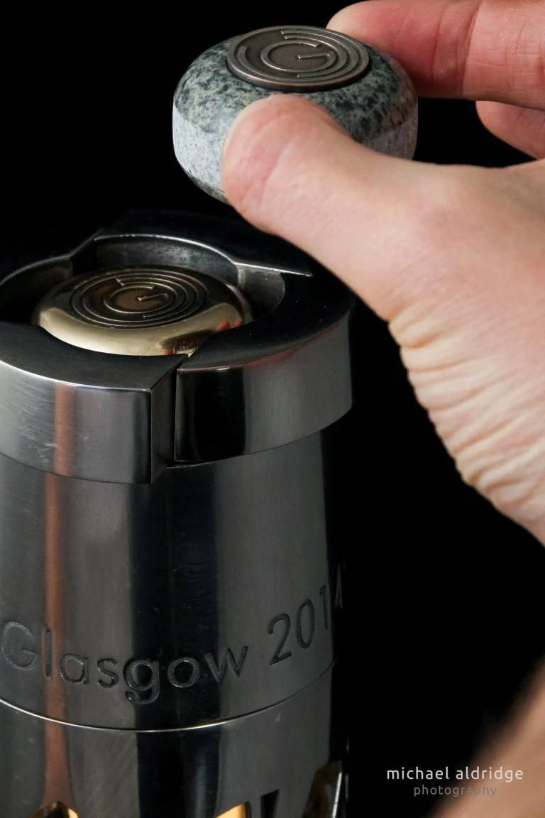 Gem being removed for puzzle mechanism of Queen's Baton